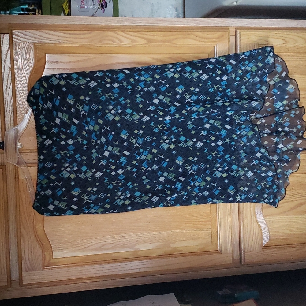 Like new high low skirt. Sheer with black liner. Elastic waist. Beautiful colors